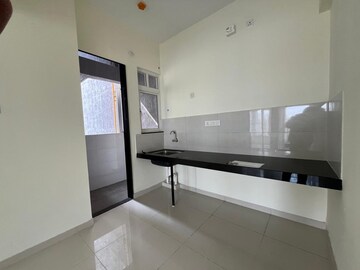 Kitchen in 2 BHK Apartment at Kolte Patil R10, Hinjewadi – for Rent
