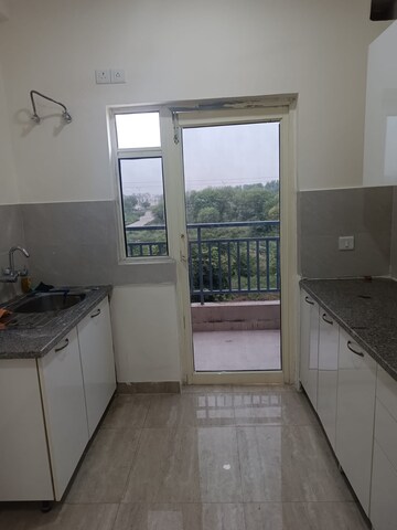 Kitchen in 3.5 BHK Builder Floor at Puri Aman Vilas, Sector 89 – for Rent