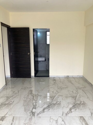 Room in 2 BHK Apartment at Rajvi Ashtavinayak, Andheri West – for Sale