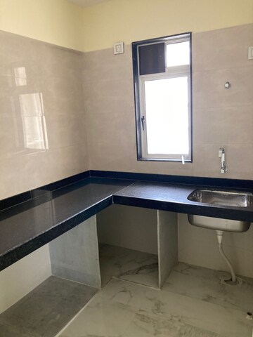 Kitchen in 2 BHK Apartment at Rajvi Ashtavinayak, Andheri West – for Sale