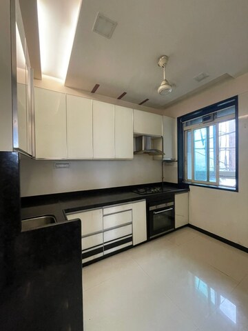 Kitchen in 2 BHK Apartment at Rustomjee Urbania Azziano, Thane West – for Rent