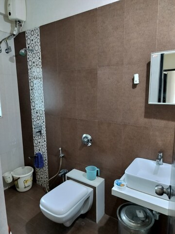 Bathroom in 3 BHK Apartment at Harmony Sky Suites, Ghodbunder Road – for Rent