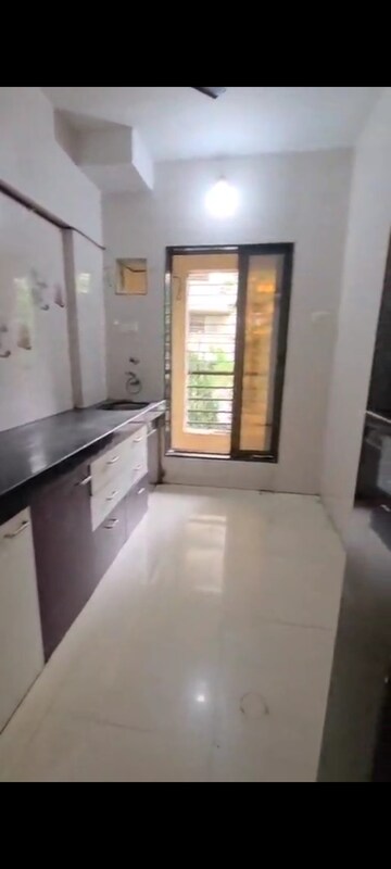 Kitchen in 2 BHK Apartment at Indralok Complex, Mira Road – for Sale