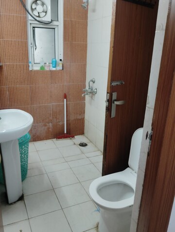 Bathroom in 2 BHK Apartment at Mahagun Mascot, Sain Vihar – for Rent
