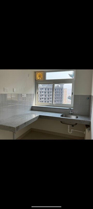 Kitchen in 2 BHK Apartment at Shapoorji Pallonji Siennaa, Kandivali East – for Rent