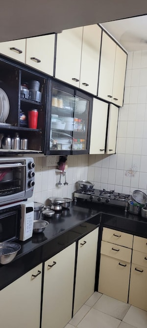 Kitchen in 1 BHK Apartment at Grant Road – for Sale