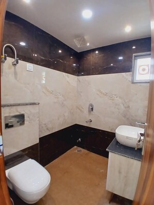 Bathroom in 3 BHK Apartment at Mahavir Enclave 1 – for Sale