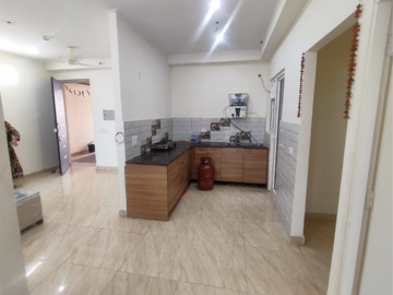 Kitchen in 2 BHK Apartment at Gaur Yamuna City 16th Park View, Sector 19 Yamuna Expressway – for Rent