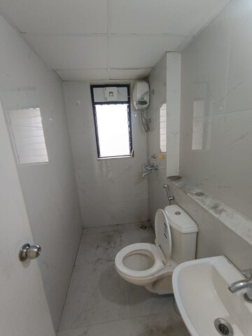 Bathroom in 3 BHK Apartment at Runwal Gardens Phase I, Dombivli East – for Rent