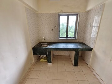 Kitchen in 1 BHK Apartment at Eden Woods complex, Manpada – for Rent
