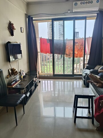 Living Room in 1 BHK Apartment at Coral Heights, Kavesar – for Rent