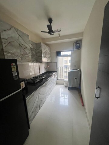 Kitchen in 2 BHK Apartment at Bini Winspace Amelio, Andheri West – for Sale