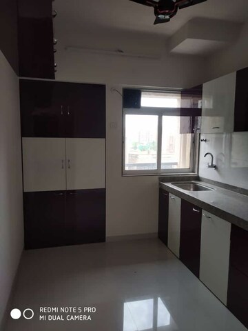 Kitchen in 2 BHK Apartment at Squarefeet Ace Square, Ghodbunder Road – for Rent