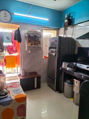 Kitchen in 2 BHK Apartment at Himgiri Lokupvan Phase II CHS Ltd, Vasant Vihar – for Sale