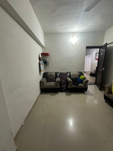 Living Room in 1 BHK Apartment at Satyam Serenity, Wadgaon Sheri – for Rent