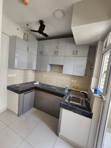 Kitchen in 2 BHK Apartment at Tata Value Homes, Sector 150 – for Rent