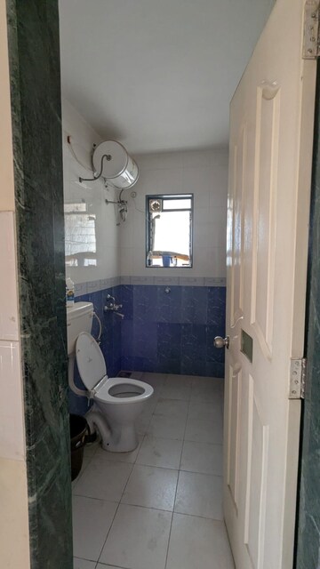 Bathroom in 2 BHK Apartment at Sudhir Mandke Advantage CHS, Lulla Nagar – for Rent
