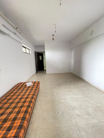 Living Room in 1 BHK Apartment at Lodha Lakeshore Greens, Dombivli East – for Sale