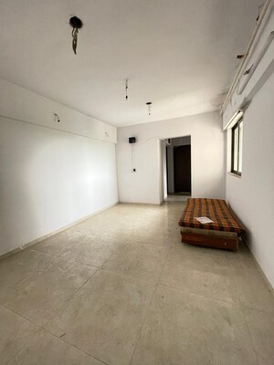 Living Room in 1 BHK Apartment at Lodha Lakeshore Greens, Dombivli East – for Sale