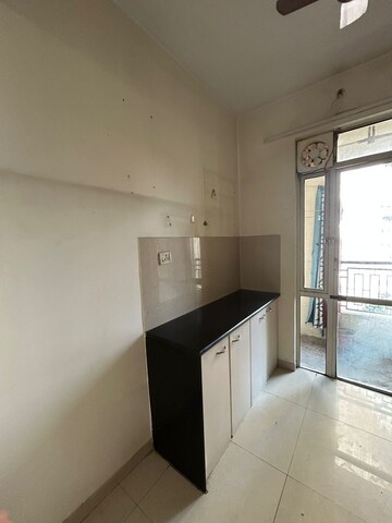 Kitchen in 1 BHK Apartment at Hiranandani Estate Capri, Ghodbunder Road – for Rent