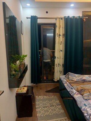 Living Room in 2 BHK Apartment at Amrapali Golf Homes, Sector 4 Greater Noida – for Sale