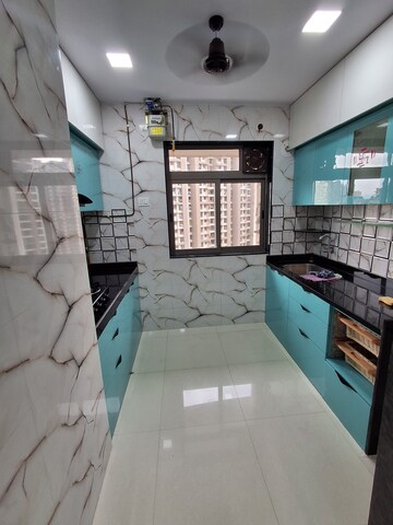 Kitchen in 2 BHK Apartment at Dosti West County, Balkum Pada – for Rent