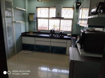 Kitchen in 3 BHK Apartment at Cosmos Park, Ghodbunder Road – for Sale