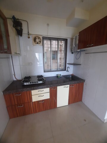 Kitchen in 1 BHK Apartment at Prabhat Upvan CHS, Gawand Baug – for Rent