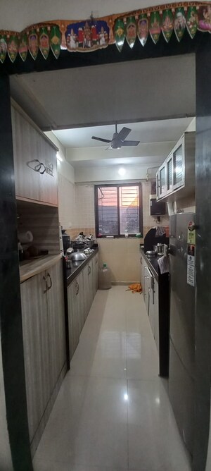 Kitchen in 3 BHK Apartment at DB Realty Parkwoods, Kasarvadavali – for Sale