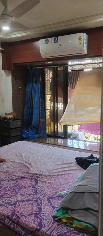Bedroom in 2 BHK Apartment at Dheeraj Darshan, Jogeshwari East – for Rent