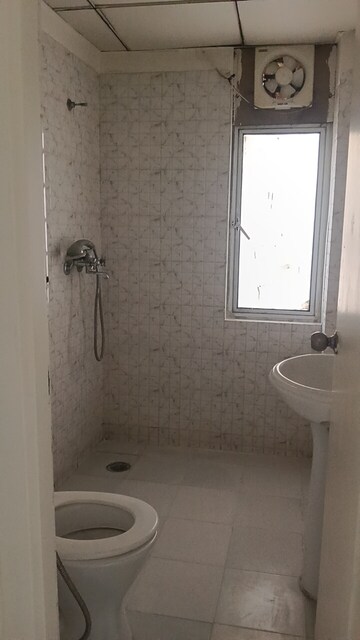 Bathroom in 4 BHK Apartment at Gaur City 6th Avenue, Sector 4 Greater Noida – for Rent
