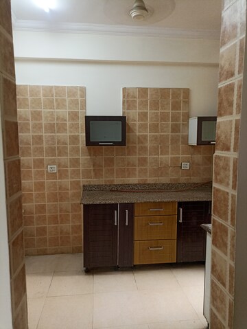 Kitchen in 2 BHK Apartment at Amrapali Eden Park, Sector 50 – for Rent
