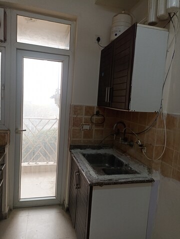 Kitchen in 2 BHK Apartment at Amrapali Eden Park, Sector 50 – for Rent