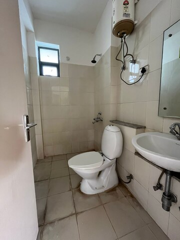 Bathroom in 2 BHK Builder Floor at Vatika India Next, Sector 82 – for Rent