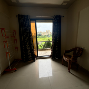 Living Room in 2 BHK Apartment at Charms Paradise, Ghotsai – for Sale