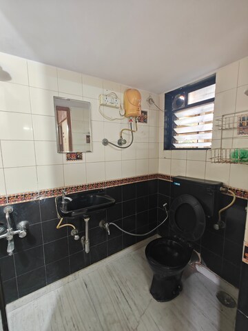 Bathroom in 2 BHK Apartment at Sai Satnam CHS, Nerul – for Rent