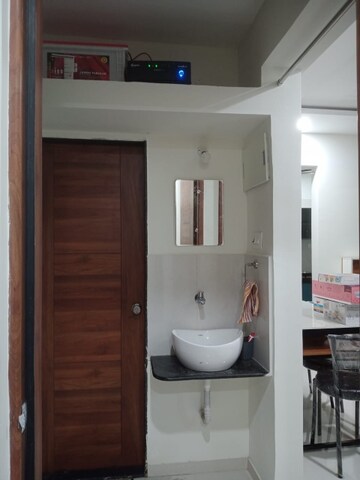 Bathroom in 2 BHK Apartment at Nexus Sukhwani Shivom, Kiwale – for Rent