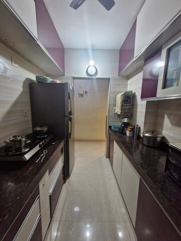 Kitchen in 2 BHK Builder Floor at Gurukrupa Marina Enclave, Malad West – for Sale