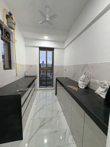Kitchen in 2 BHK Apartment at Raymond Ten X Habitat, Pokhran Road No Two – for Rent