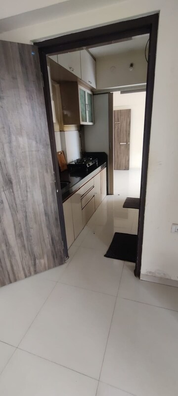 Kitchen in 1 BHK Apartment at Raunak Unnathi Woods Phase 6, Ghodbunder Road – for Rent