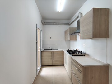 Kitchen in 2 BHK Apartment at Bhartiya City Nikoo Homes II, Thanisandra Main Road – for Rent