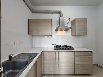 Kitchen in 2 BHK Apartment at Bhartiya City Nikoo Homes II, Thanisandra Main Road – for Rent