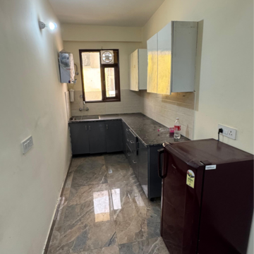 Kitchen in 2 BHK Builder Floor at Palm Residency Chhatarpur, Rajpur Khurd Extension – for Rent
