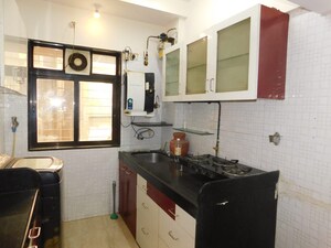Kitchen in 2 BHK Apartment at Anuradha Anuja CHS, Borivali West – for Sale