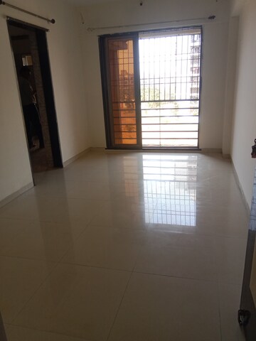 Living Room in 1 BHK Apartment at Ritu Gardenia, Naigaon East – for Rent
