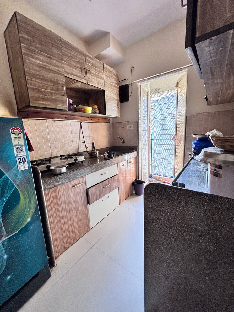 Kitchen, buddha-ozone-1 1 Bedroom 630 Sq.Ft. Apartment In Kanakia Park Thane 8979312