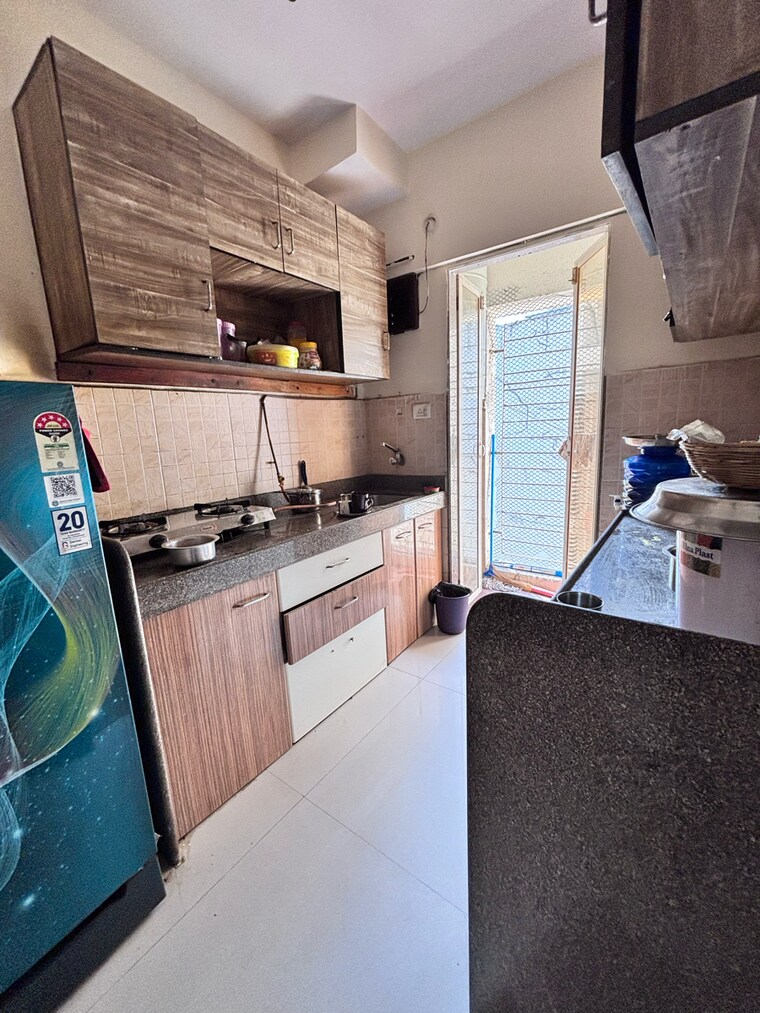 Kitchen, buddha-ozone-1 1 Bedroom 630 Sq.Ft. Apartment In Kanakia Park Thane 8979312