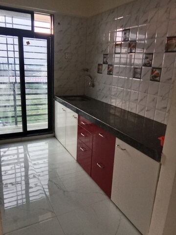 Kitchen in 2 BHK Apartment at Navkar City Phase II, Naigaon East – for Rent