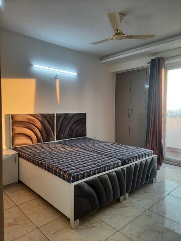 Bedroom in 3.5 BHK Apartment at Aims Golf City, Sector 75 – for Rent