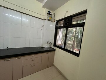 Kitchen in 1 BHK Apartment at Raunak Unnathi Woods Phase 4 And 5, Ghodbunder Road – for Rent